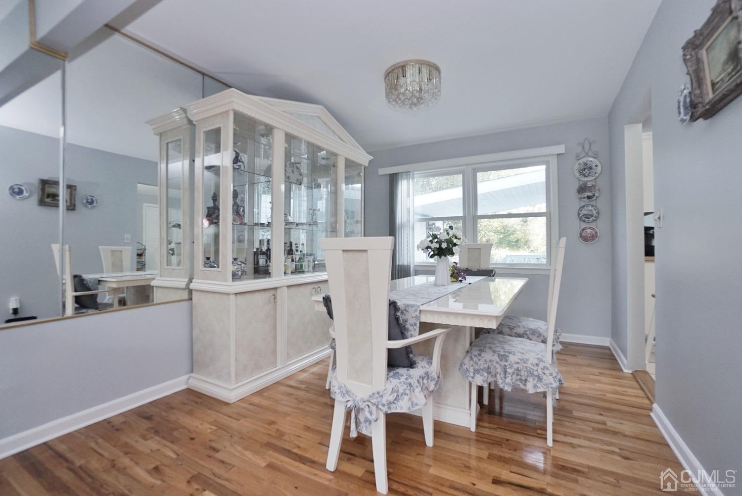 60 Annette Drive Edison, NJ 08820 - Photo 22 of 69 a view of a dining room with furniture window and wooden floor