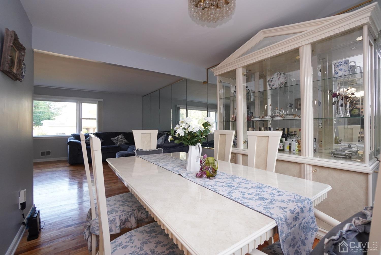 60 Annette Drive Edison, NJ 08820 - Photo 23 of 69 a view of a dining room with furniture and wooden floor