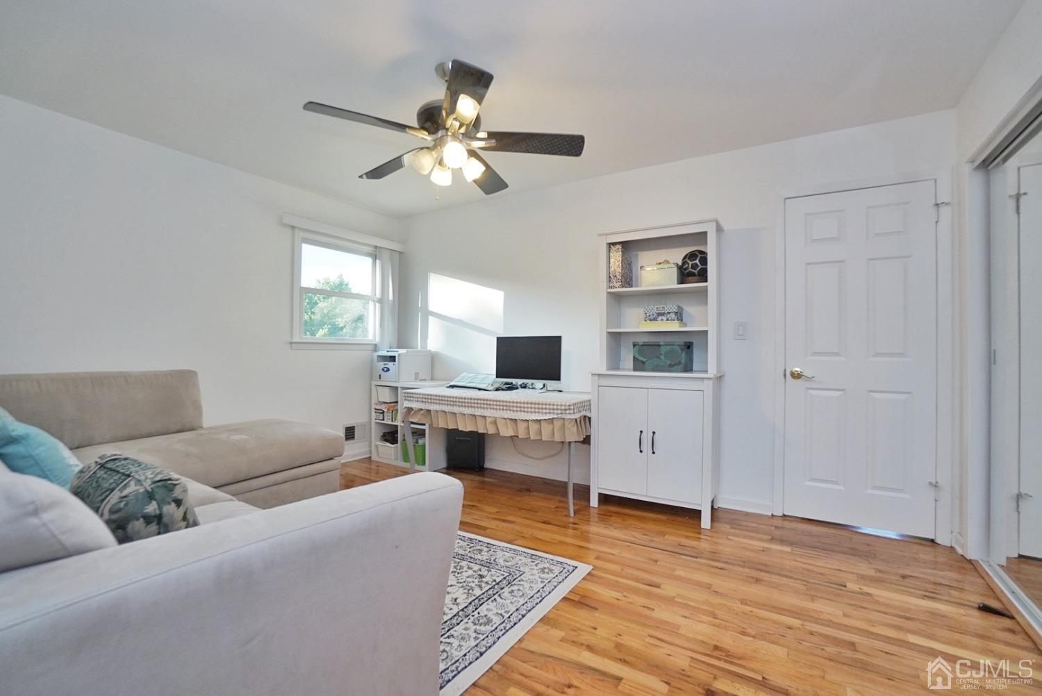 60 Annette Drive Edison, NJ 08820 - Photo 36 of 69 a living room with furniture and a wooden floor