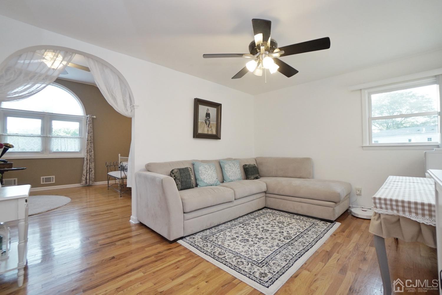 60 Annette Drive Edison, NJ 08820 - Photo 37 of 69 a living room with furniture and a wooden floor