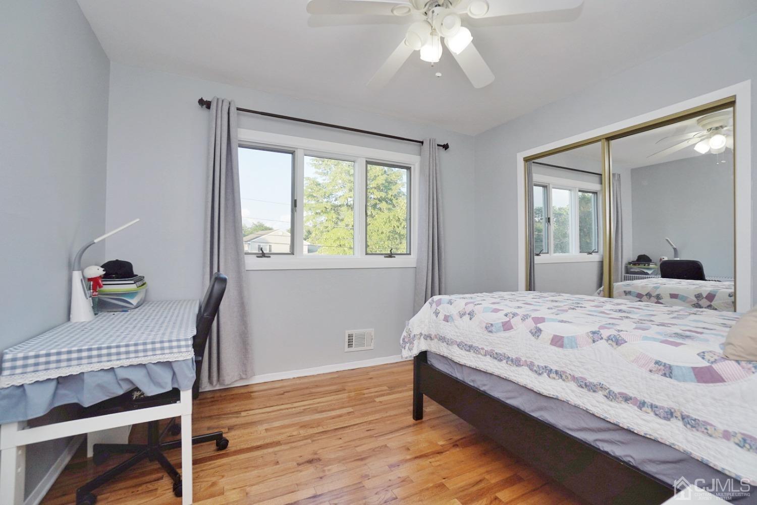 60 Annette Drive Edison, NJ 08820 - Photo 40 of 69 a bedroom with a bed and a table in it