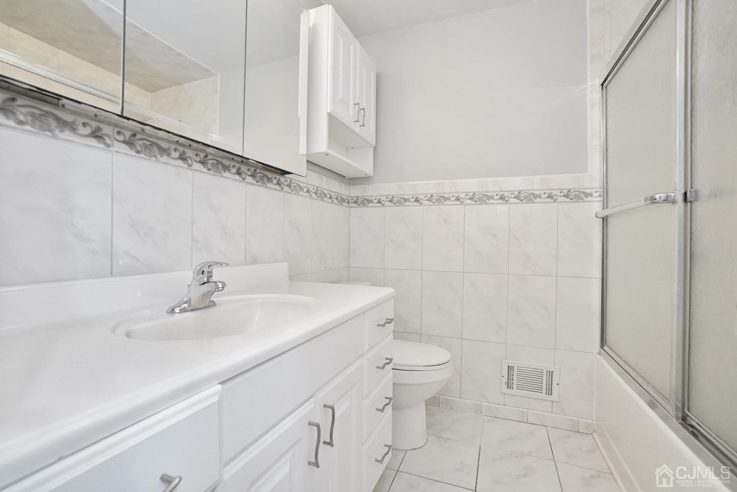 60 Annette Drive Edison, NJ 08820 - Photo 42 of 69 a bathroom with a sink a toilet and shower