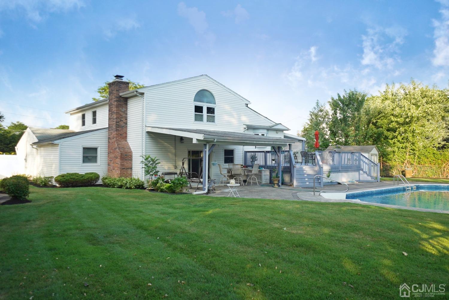 60 Annette Drive Edison, NJ 08820 - Photo 59 of 69 a view of a house with a yard and sitting area
