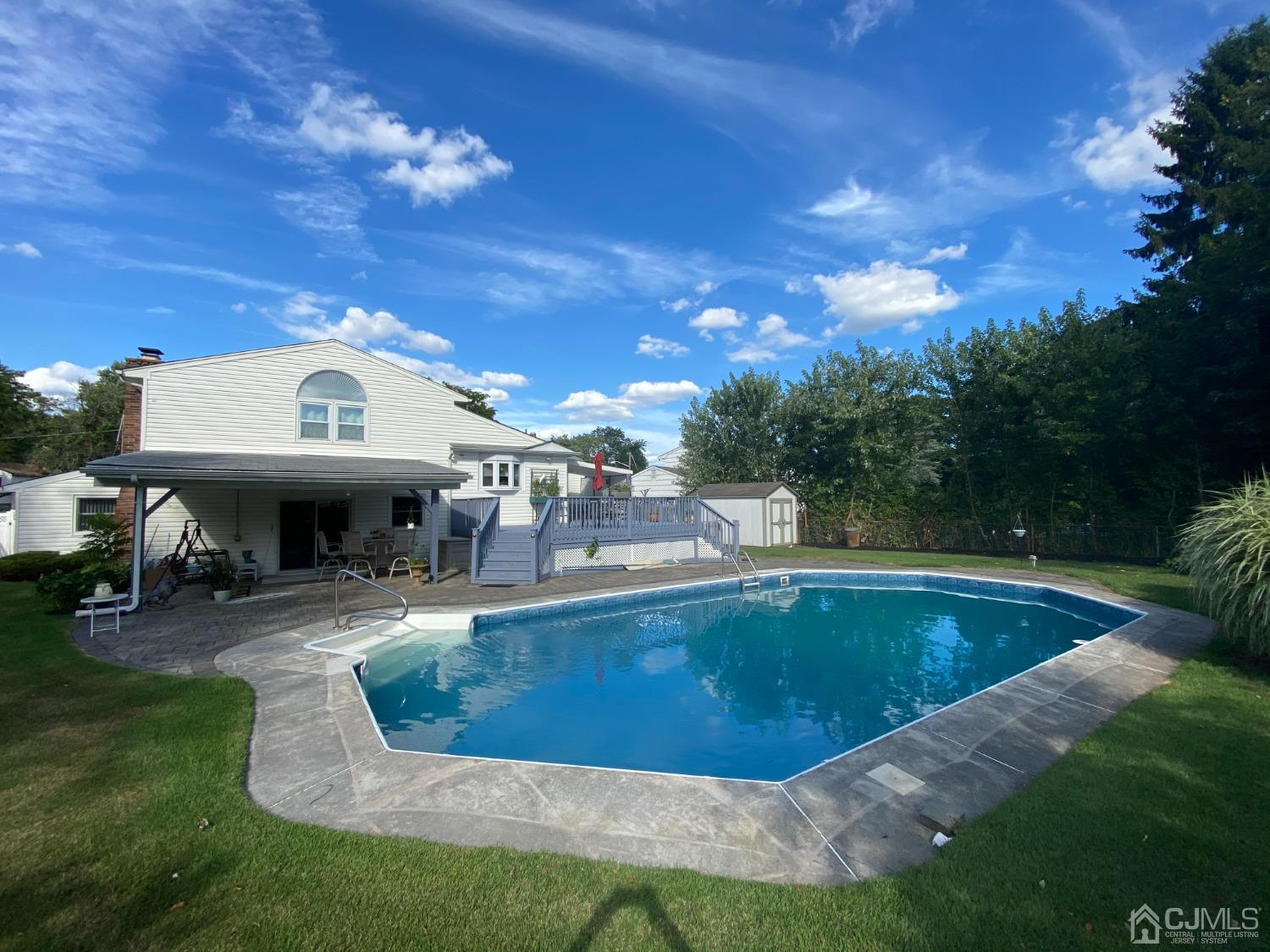 60 Annette Drive Edison, NJ 08820 - Photo 63 of 69 a view of a swimming pool with sitting area