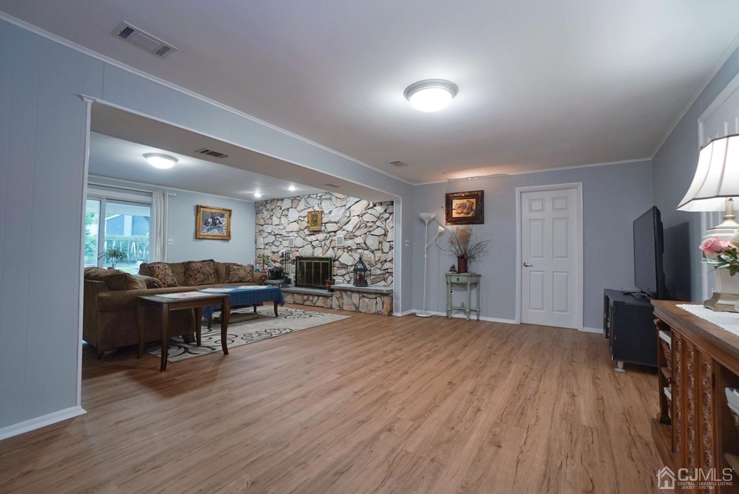 60 Annette Drive Edison, NJ 08820 - Photo 9 of 69 a living room with furniture and a flat screen tv
