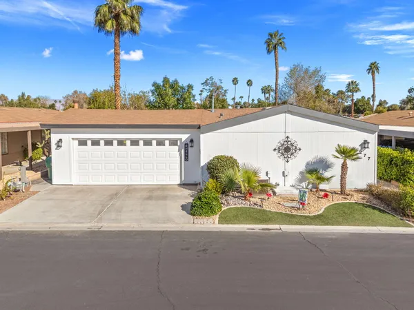 a view of a patio with table and chairs and potted plants