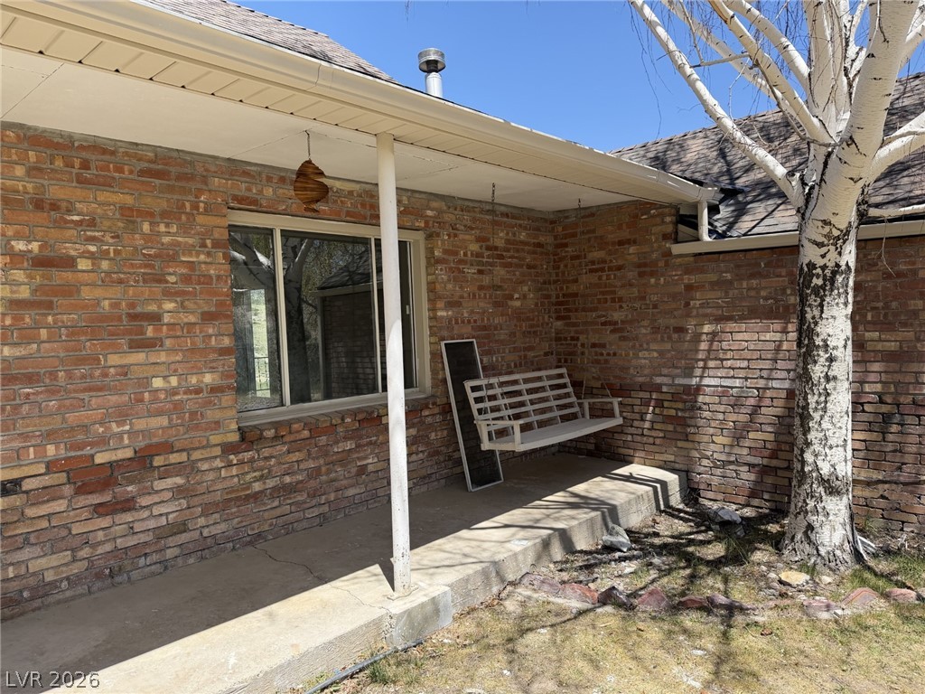 1 Carson Court Ely, NV 89301 - Photo 3 of 20 This cozy outdoor space features a porch swing, perfect for relaxing afternoons.