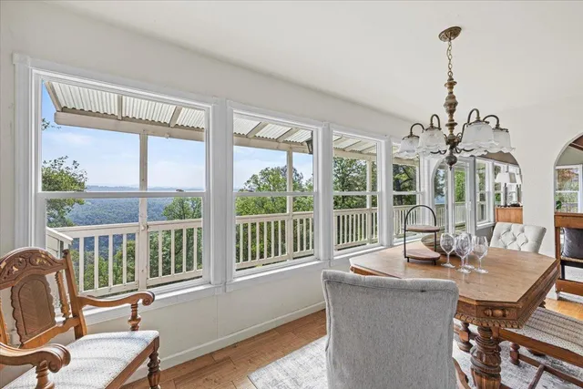 a view of a livingroom with furniture and staircase