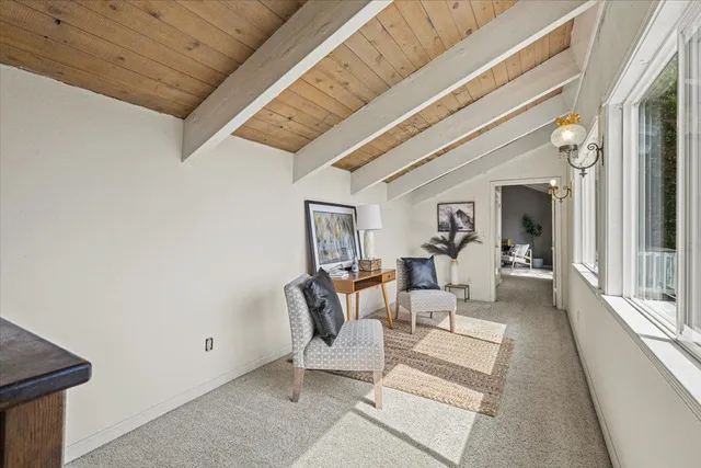 a bedroom with a large bed and a table