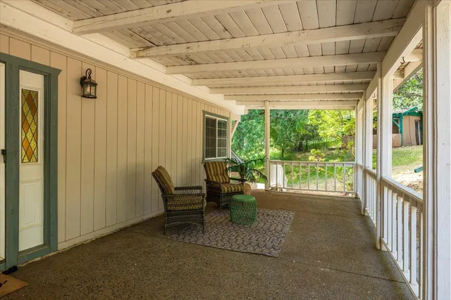 a living room with furniture and a garden