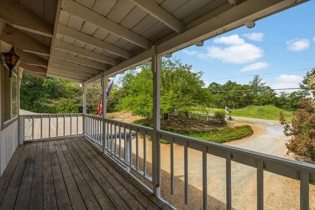 a bed room with a bed and a chair