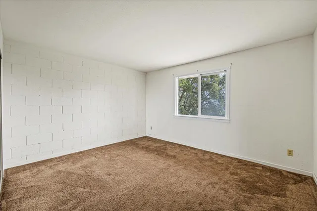 a bathroom with a sink toilet vanity and shower