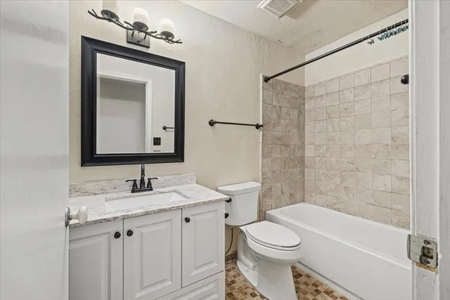 a bathroom with a bathtub and shower