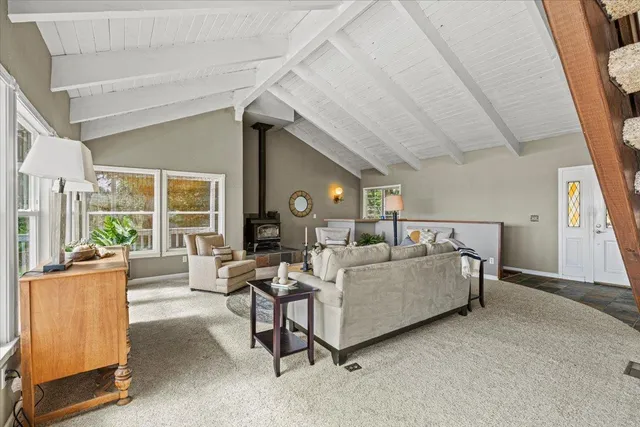 a kitchen that has a sink and a stove in it