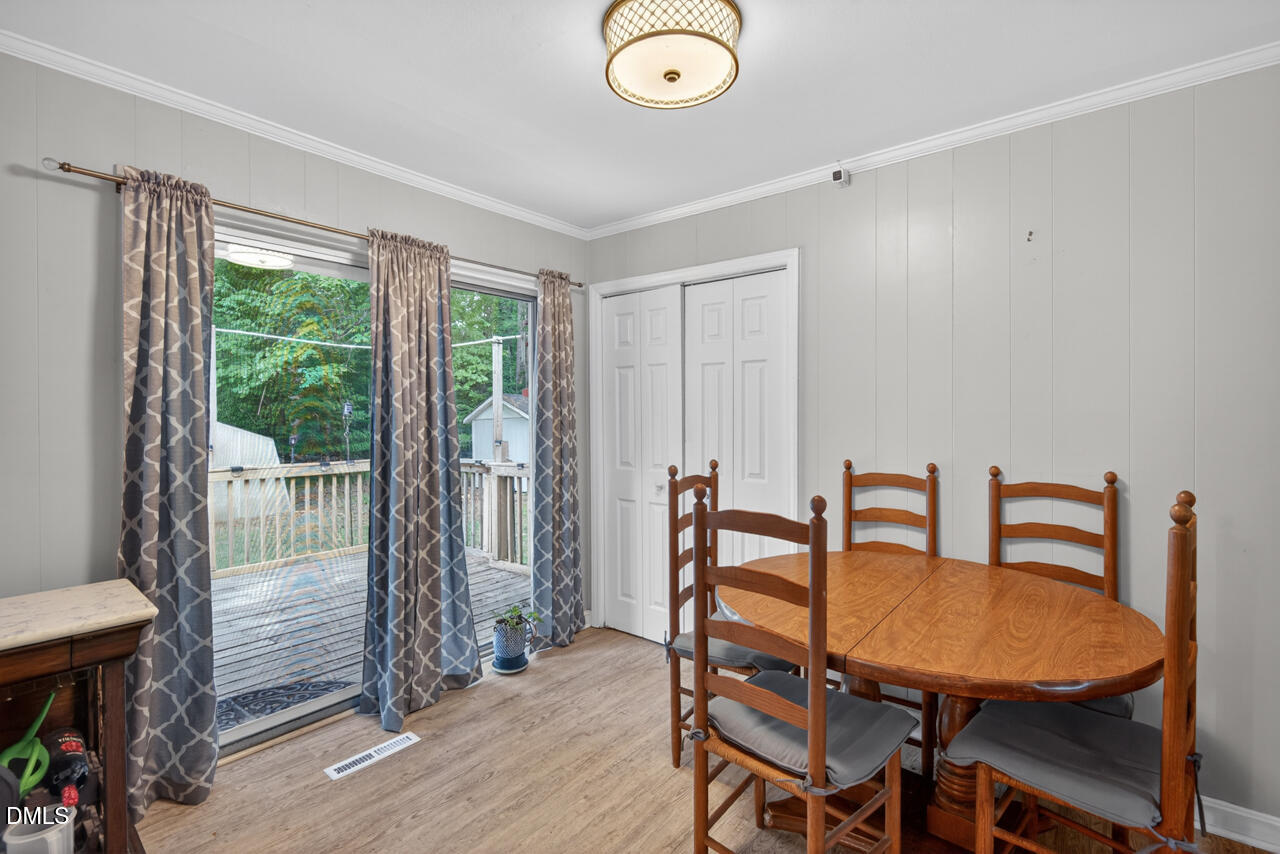 1420 Goodwin Road Durham, NC 27712 - Photo 15 of 54 a view of a dining room with furniture window and outside view