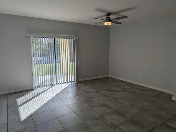 an empty room with fan