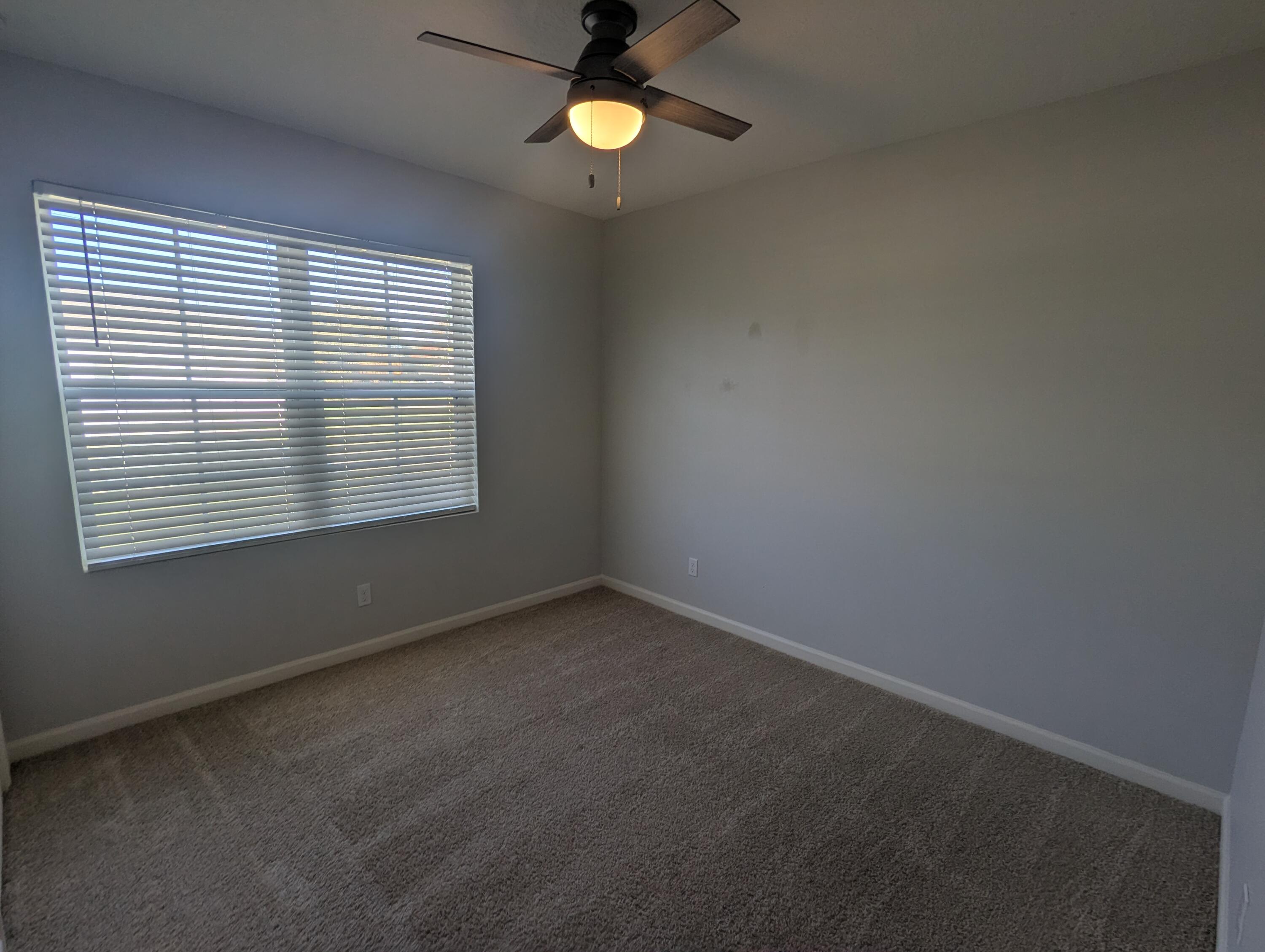 284 Southwest Ridgecrest Drive Port St. Lucie, FL 34953 - Photo 2 of 16 an empty room with a window