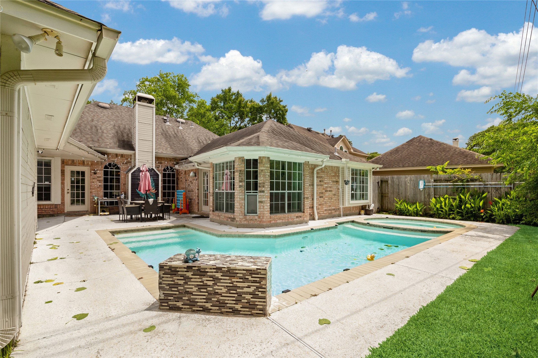 9110 Rhapsody Lane Houston, TX 77040 - Photo 2 of 20 This property showcases a luxurious pool and hot tub.