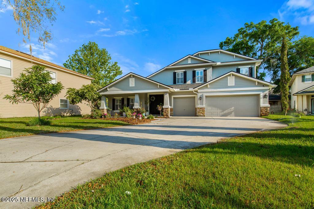 3139 Ashgrove Road Jacksonville, FL 32226 - Photo 12 of 81 a front view of a house with a garden