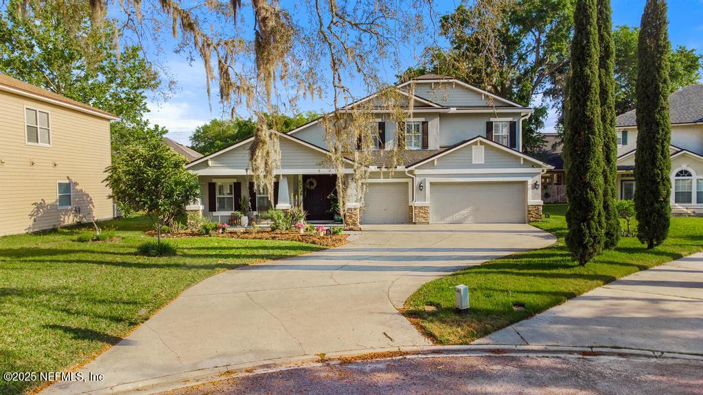 3139 Ashgrove Road Jacksonville, FL 32226 - Photo 14 of 81 a front view of a house with a yard and trees