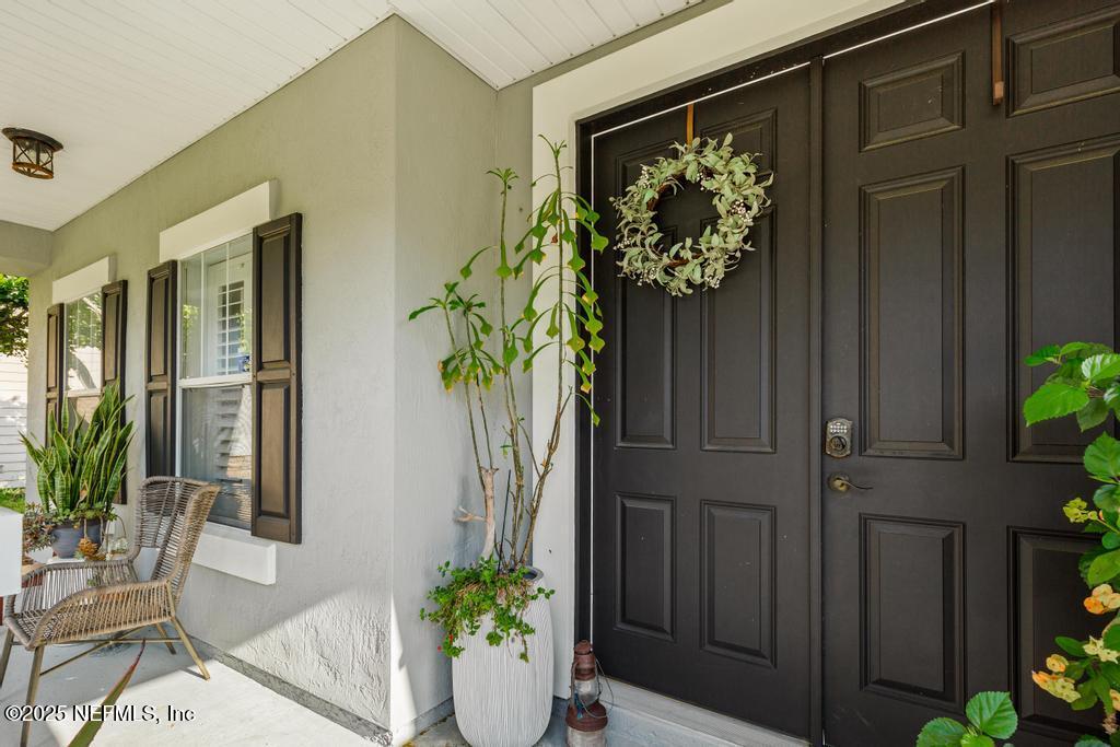 3139 Ashgrove Road Jacksonville, FL 32226 - Photo 18 of 81 a potted plant sitting in front of a door