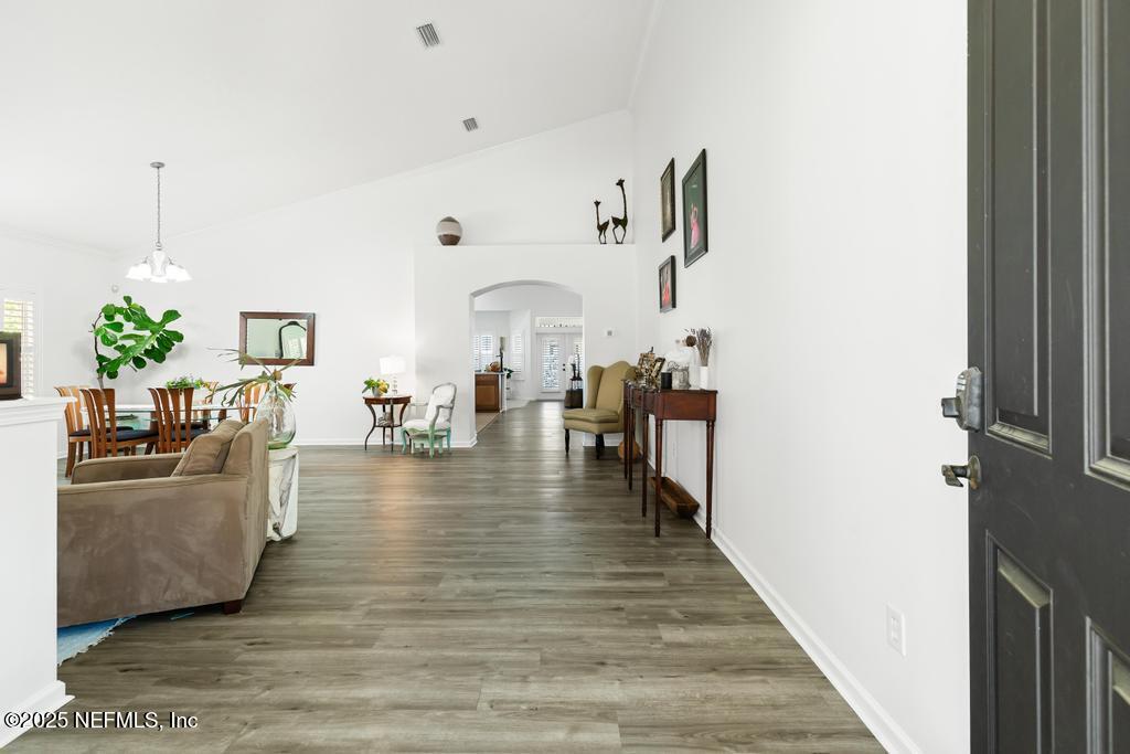 3139 Ashgrove Road Jacksonville, FL 32226 - Photo 19 of 81 a living room with furniture and a wooden floor