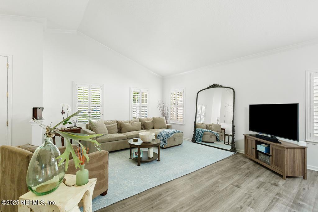 3139 Ashgrove Road Jacksonville, FL 32226 - Photo 21 of 81 a living room with furniture and a flat screen tv