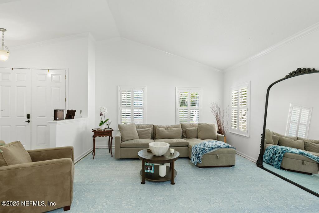 3139 Ashgrove Road Jacksonville, FL 32226 - Photo 22 of 81 a living room with furniture and a large window