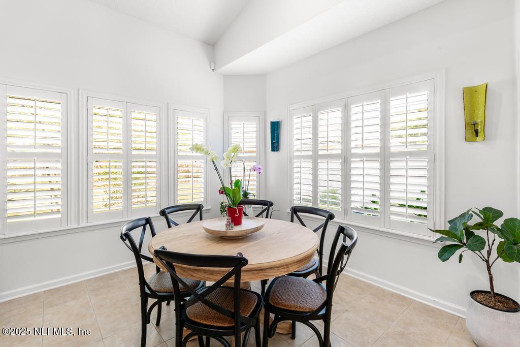 3139 Ashgrove Road Jacksonville, FL 32226 - Photo 33 of 81 a view of a dining room with furniture and window