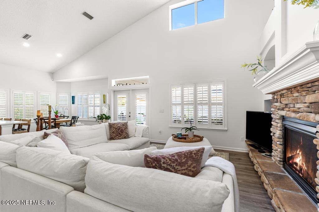 3139 Ashgrove Road Jacksonville, FL 32226 - Photo 36 of 81 a living room with furniture a fireplace and a flat screen tv