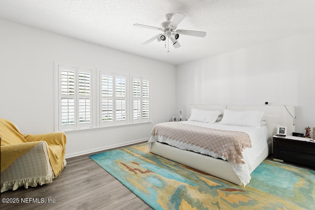 3139 Ashgrove Road Jacksonville, FL 32226 - Photo 42 of 81 a spacious bedroom with a bed and a couch