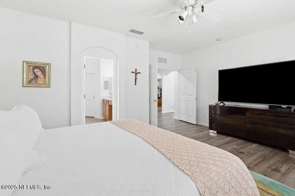 3139 Ashgrove Road Jacksonville, FL 32226 - Photo 43 of 81 a bedroom with a bed and a flat screen tv