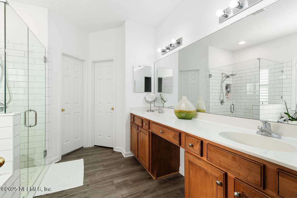 3139 Ashgrove Road Jacksonville, FL 32226 - Photo 46 of 81 a spacious bathroom with double vanity and a shower