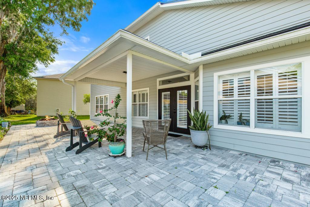 3139 Ashgrove Road Jacksonville, FL 32226 - Photo 5 of 81 a view of a house with backyard and sitting area