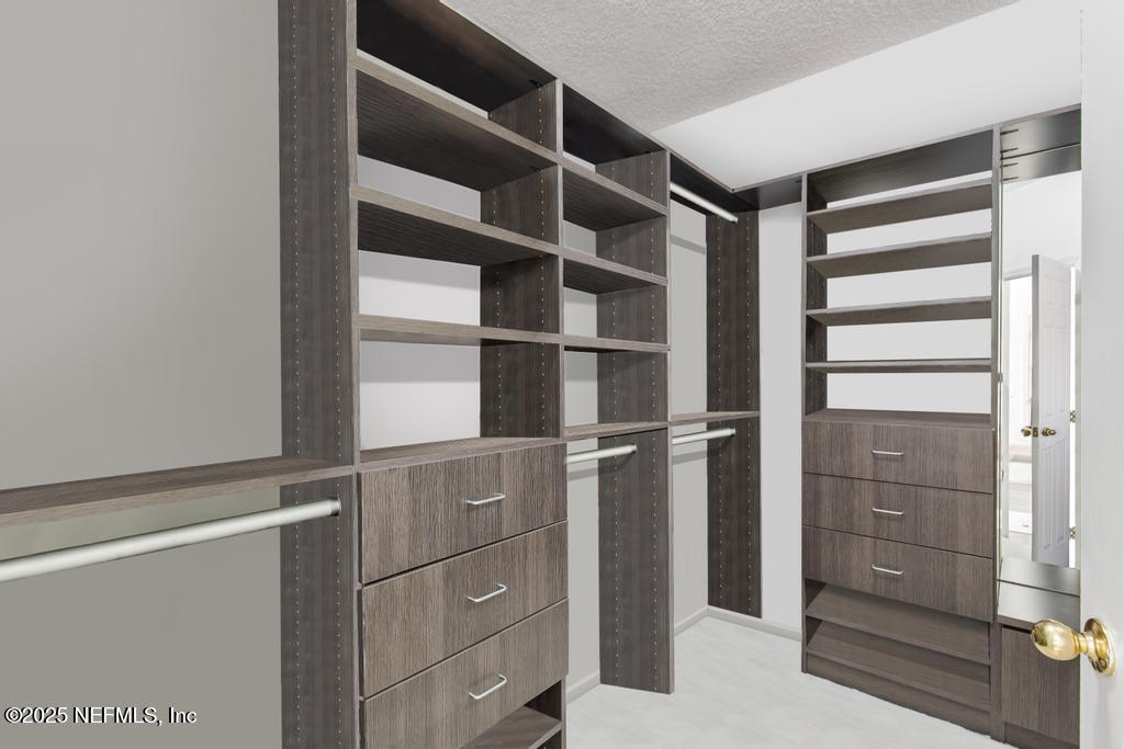 3139 Ashgrove Road Jacksonville, FL 32226 - Photo 52 of 81 a view of walk in closet with empty racks