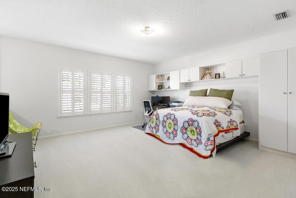 3139 Ashgrove Road Jacksonville, FL 32226 - Photo 65 of 81 a bedroom with a bed and a window