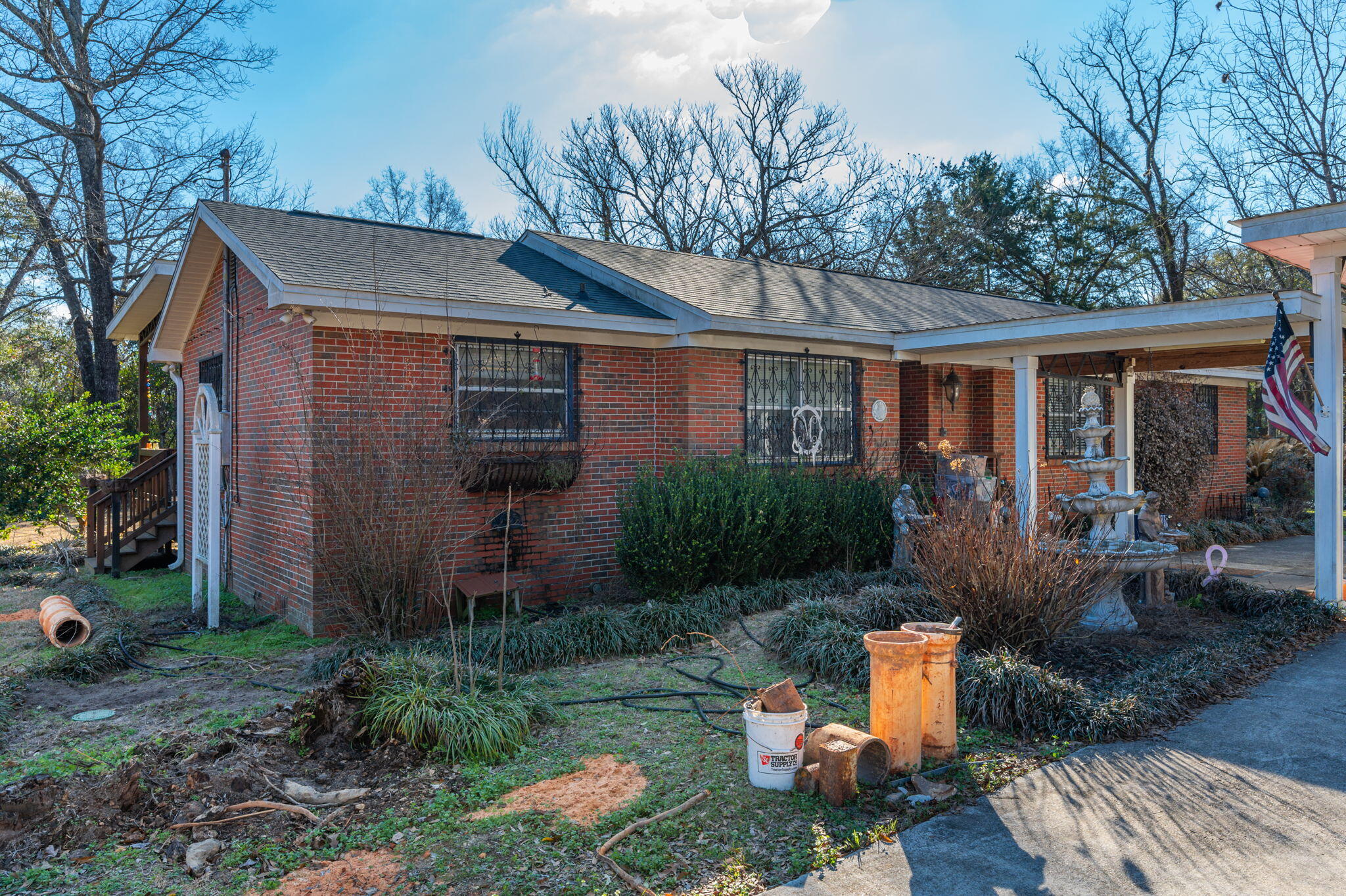5771 Flora Lee Lane Crestview, FL 32539 - Photo 18 of 66 a view of a house with backyard sitting area and garden