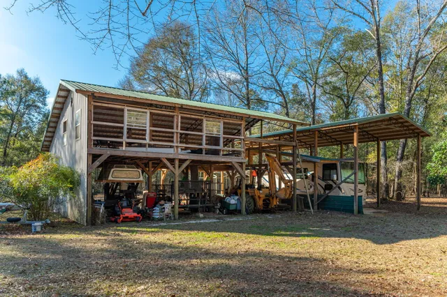 a living room with furniture and a mirror