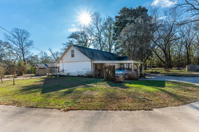 an aerial view of house with yard