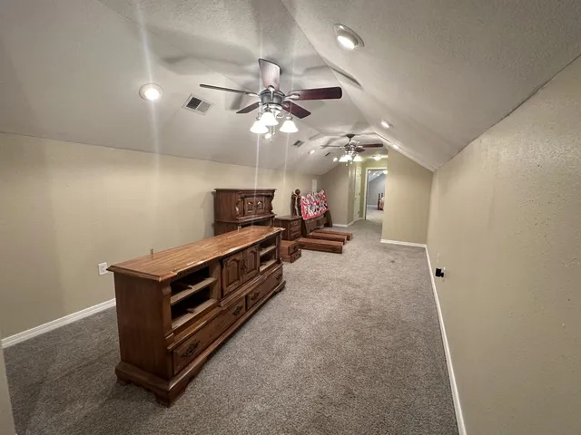 a view of a patio with a table and chairs
