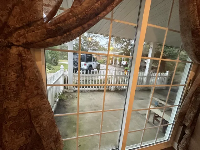 a view of a yard with cars parked