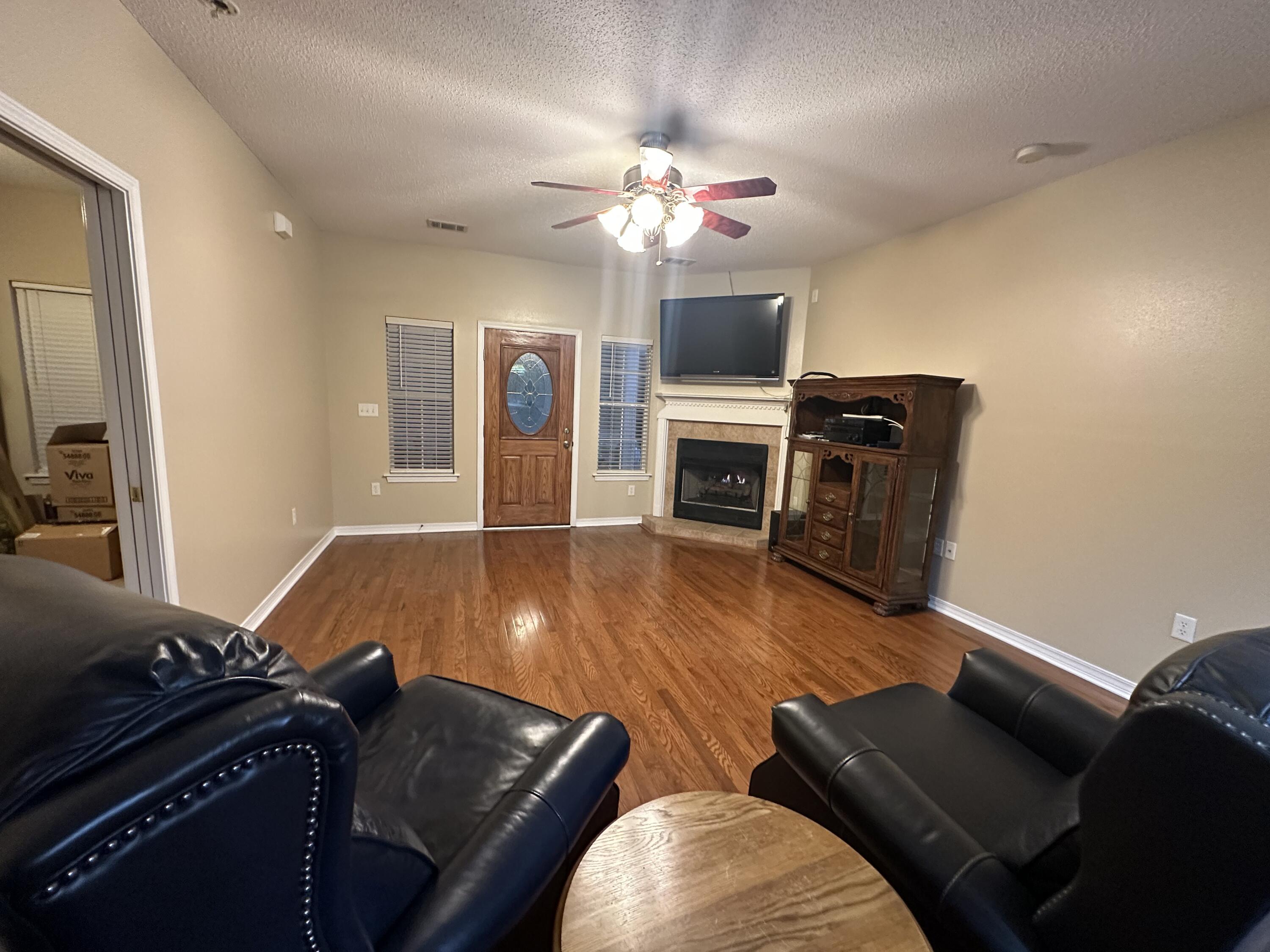 5771 Flora Lee Lane Crestview, FL 32539 - Photo 56 of 66 a living room with furniture and a flat screen tv