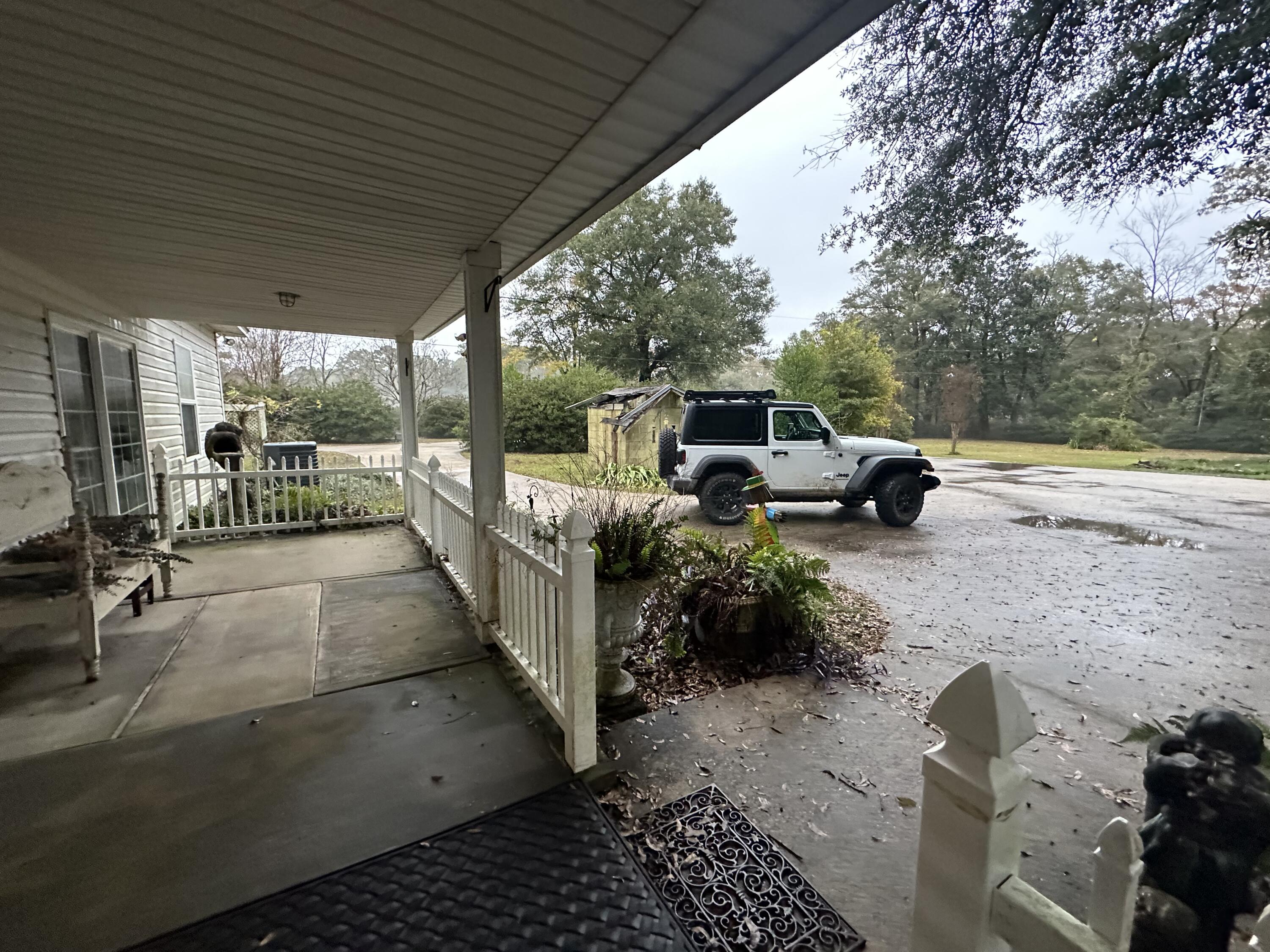 5771 Flora Lee Lane Crestview, FL 32539 - Photo 63 of 66 a view of a patio with a table and chairs