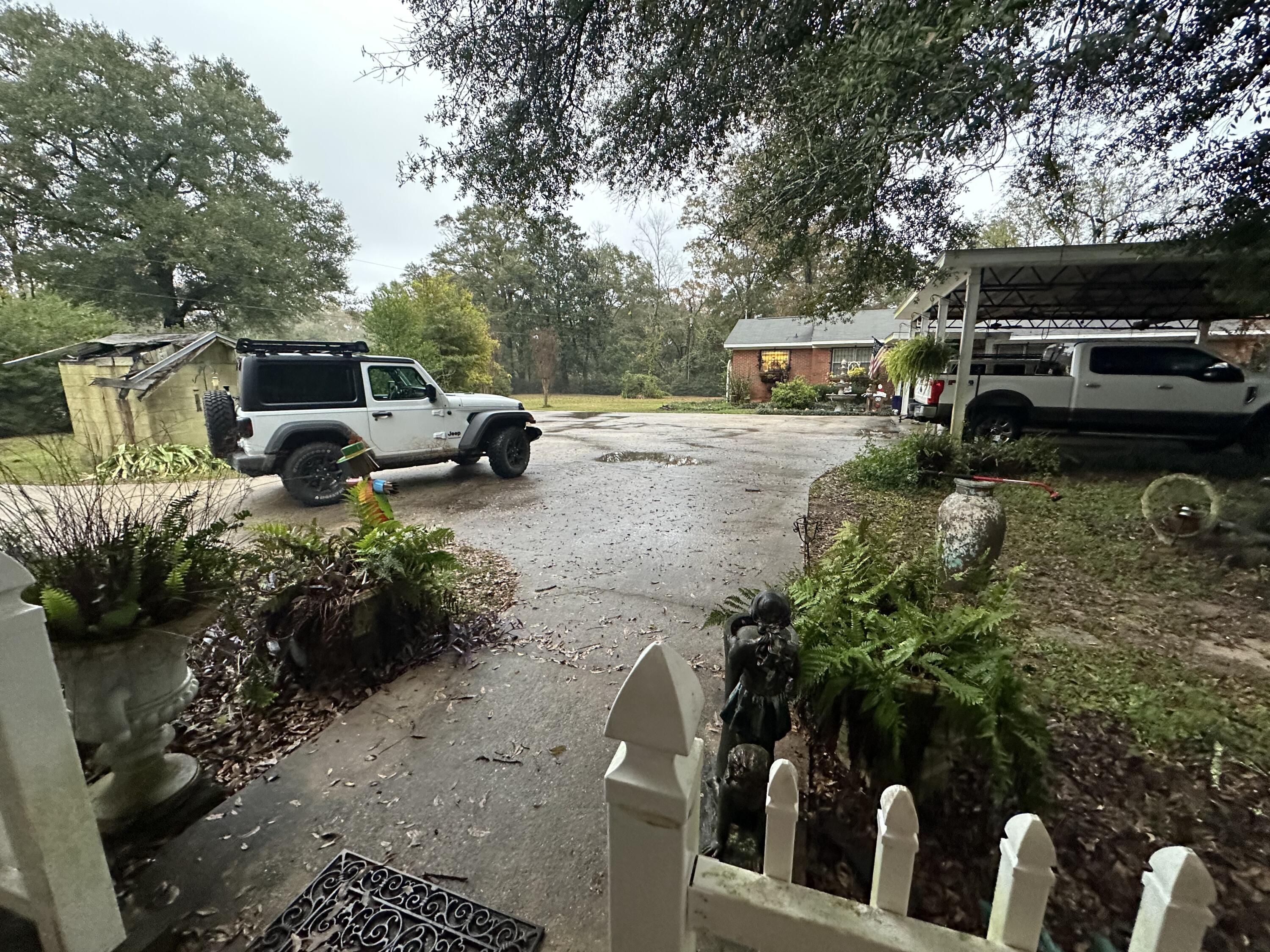 5771 Flora Lee Lane Crestview, FL 32539 - Photo 64 of 66 a view of a yard with cars parked
