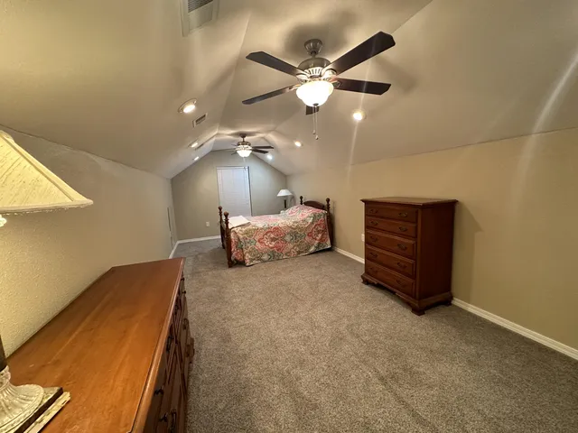 a view of an empty room with a staircase