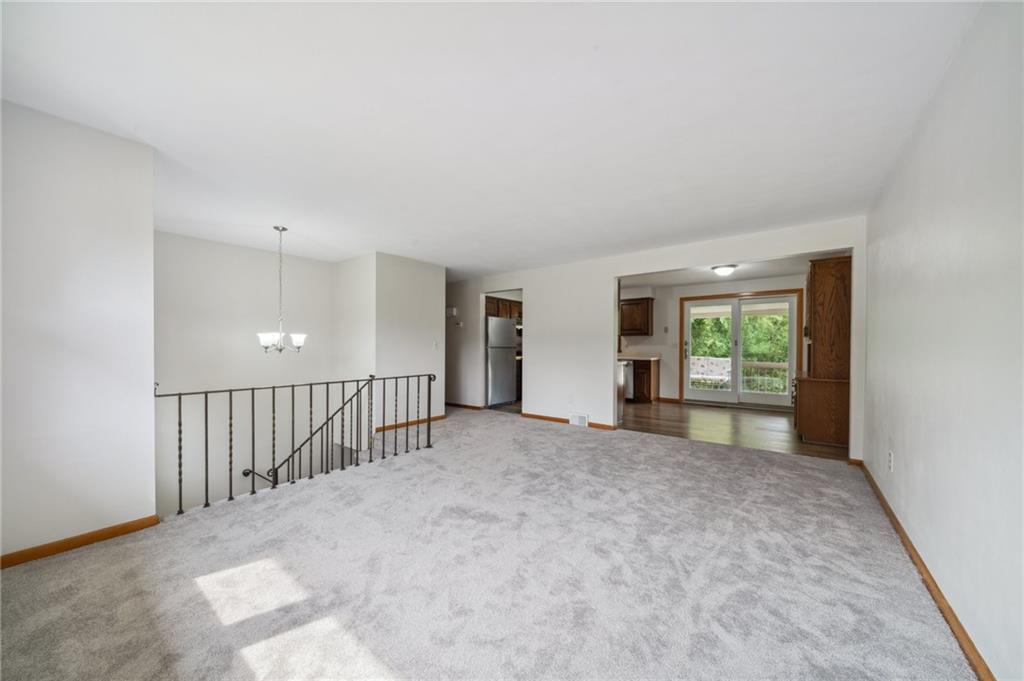 331 East Union Road Cheswick, PA 15024 - Photo 4 of 26 a view of a big room with windows and stairs