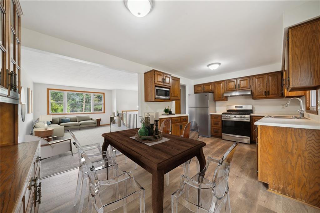 331 East Union Road Cheswick, PA 15024 - Photo 5 of 26 a kitchen with a table chairs refrigerator and cabinets