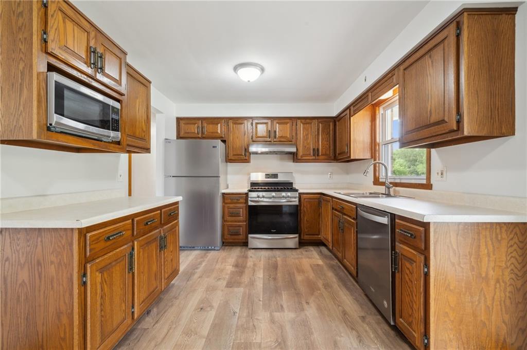 331 East Union Road Cheswick, PA 15024 - Photo 7 of 26 a kitchen with stainless steel appliances granite countertop a refrigerator a stove top oven a sink and dishwasher