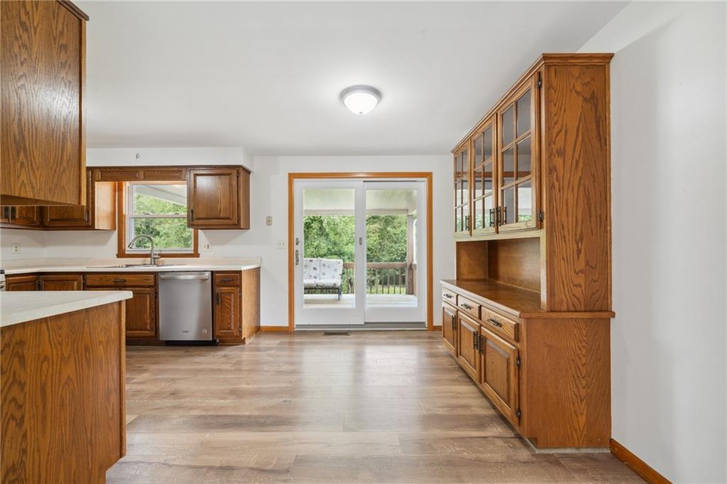 331 East Union Road Cheswick, PA 15024 - Photo 8 of 26 a kitchen with granite countertop a stove a sink and a refrigerator