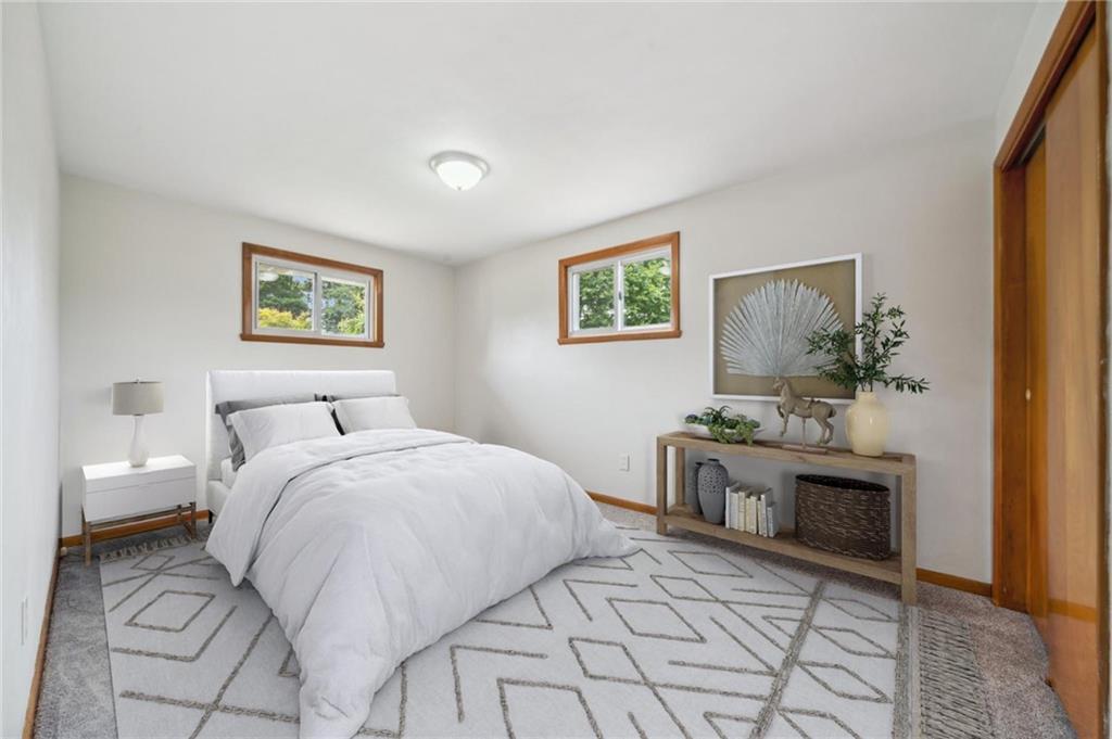 331 East Union Road Cheswick, PA 15024 - Photo 10 of 26 a bedroom with a bed and a chandelier